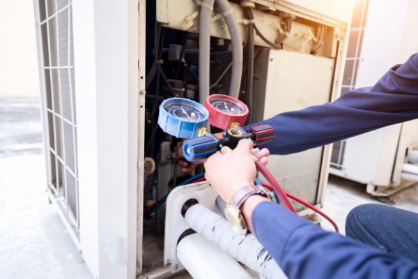 Technician Is Checking Air Conditioner Measuring Equipment Filling Air Conditioners 34936 2759
